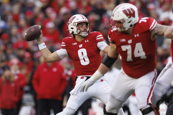 Nov 11, 2023; Madison, Wisconsin, USA; Wisconsin Badgers quarterback Tanner Mordecai (8) throws a pass during the second quarter against the Northwestern Wildcats at Camp Randall Stadium. Mandatory Credit: Jeff Hanisch-USA TODAY Sports